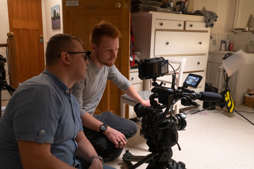 Birthday short film - behind the scenes. The 2 camera men looking at the camera